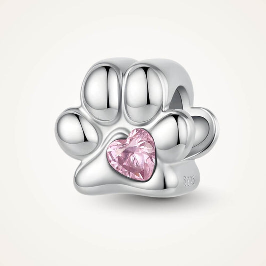 Sterling silver paw print charm with pink heart crystal center and polished pet-inspired details - ORÉYA