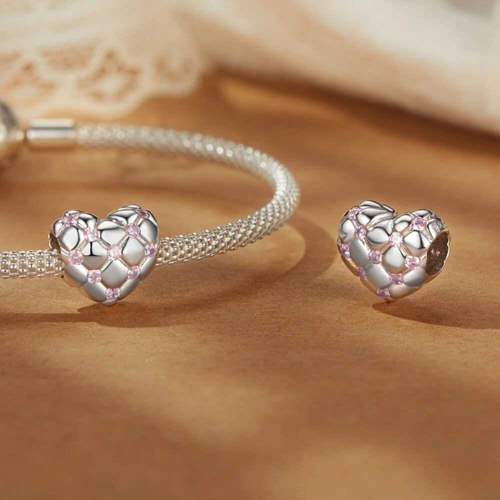 Sterling silver heart charm with pink crystals and quilted padded design.