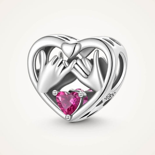 Sterling silver pinky promise charm with intertwined hands, pink heart crystal, and romantic heart frame - ORÉYA