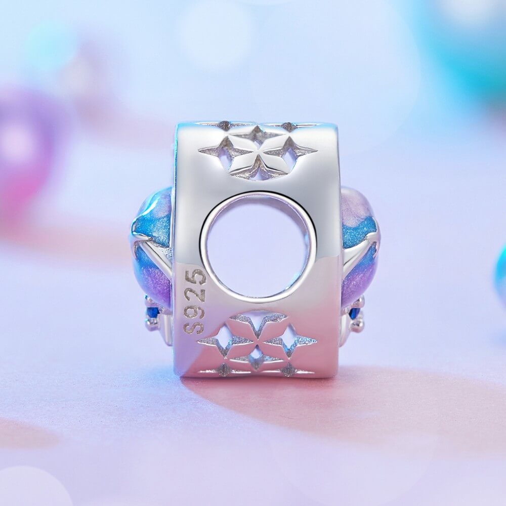 Sterling silver planet charm with blue purple crystals and sparkling star details.