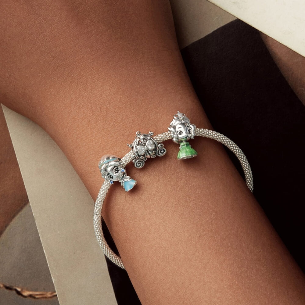 Sterling silver pumpkin carriage charm with heart-shaped crystals.