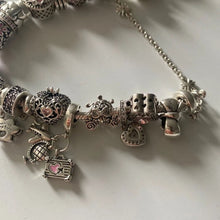 Sterling silver pumpkin carriage charm with heart-shaped crystals.