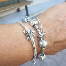 Sterling silver pumpkin carriage charm with heart-shaped crystals.