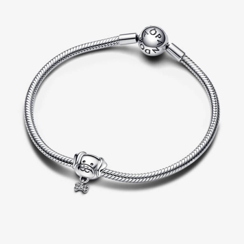 Sterling silver puppy head charm with dangling crystal bone