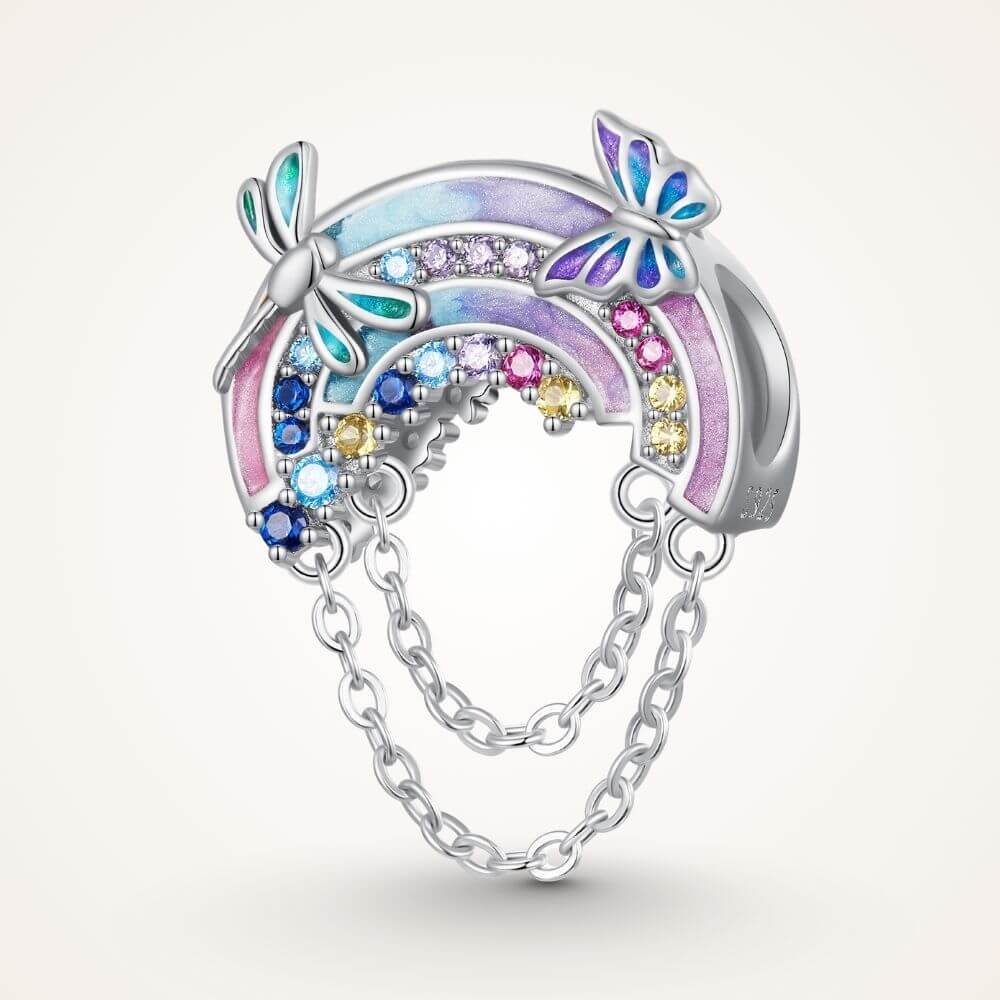Sterling silver rainbow charm with colorful crystals, butterfly details, glitter enamel, and dangling safety chains - ORÉYA