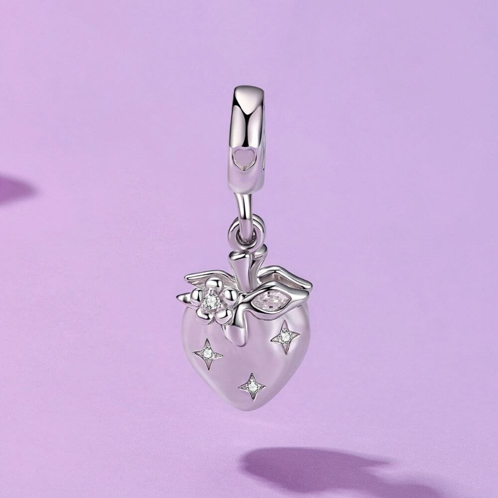 Sterling silver heart charm with red crystal center, floral details, stars, and a romantic double-heart design.