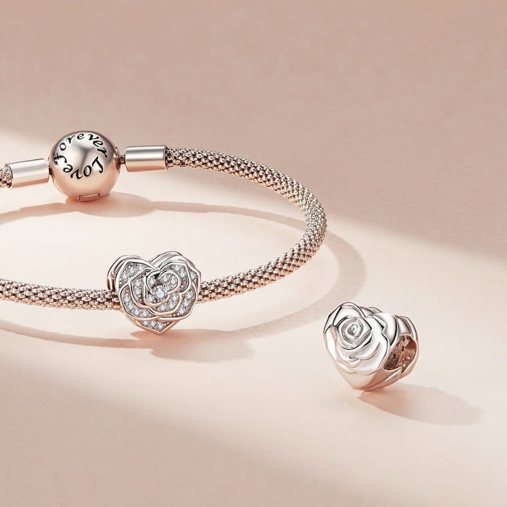 Sterling silver rose heart charm with sparkling crystal pavé details.
