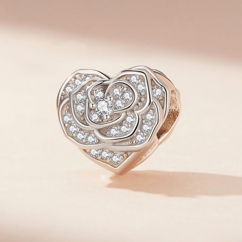 Sterling silver rose heart charm with sparkling crystal pavé details.