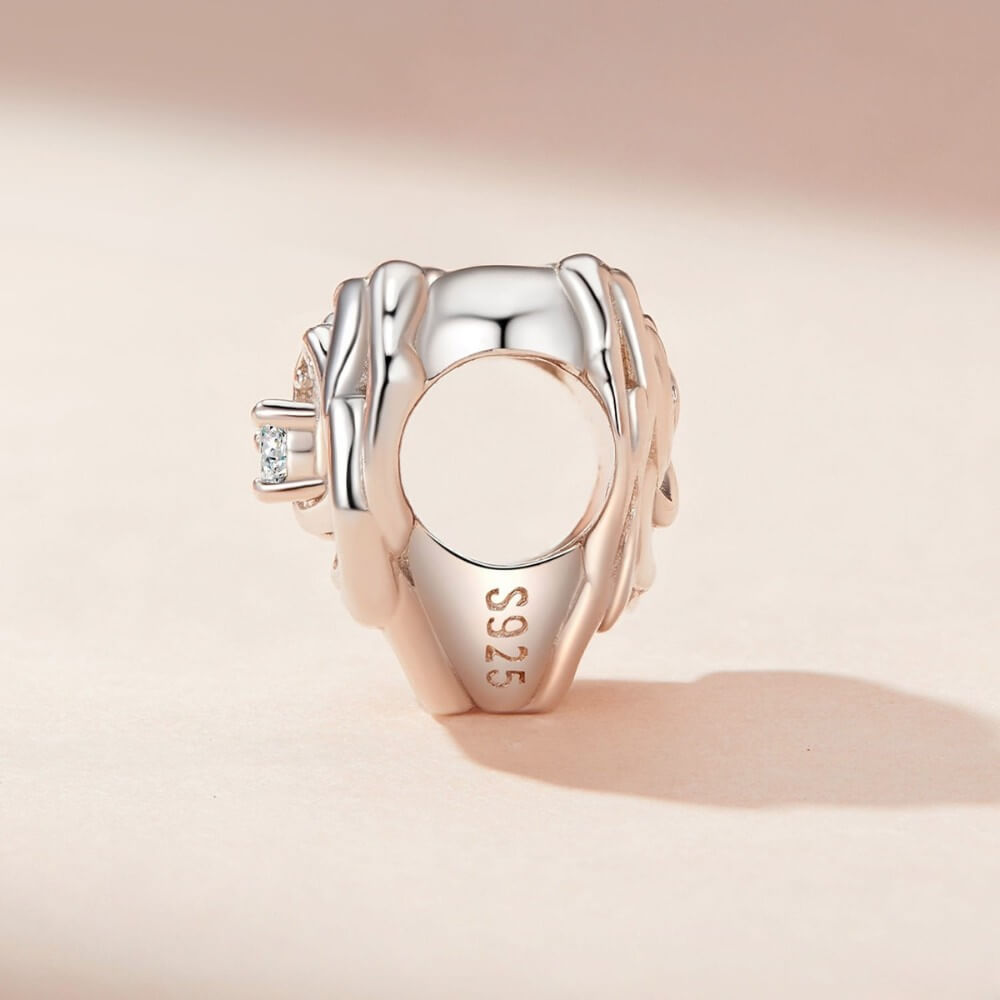 Sterling silver rose heart charm with sparkling crystal pavé details.