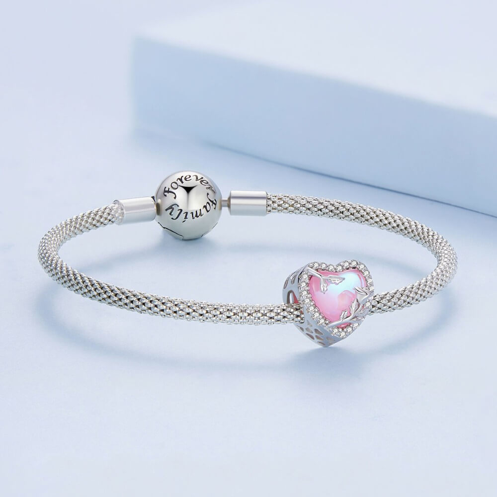 Sterling silver rose heart charm with pink opal center and crystal border.