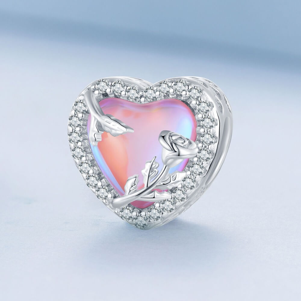 Sterling silver rose heart charm with pink opal center and crystal border.