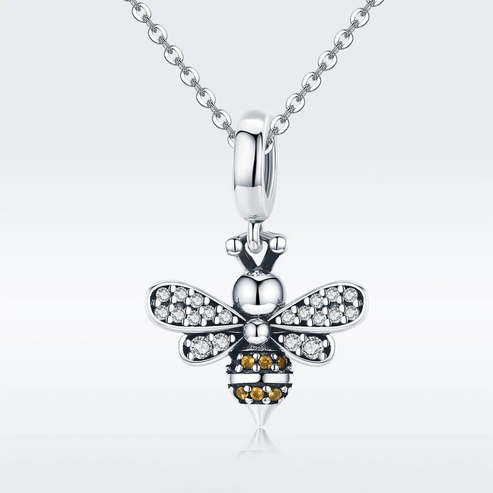 Sterling silver bee charm with crystal-paved wings and orange gemstone stripes 