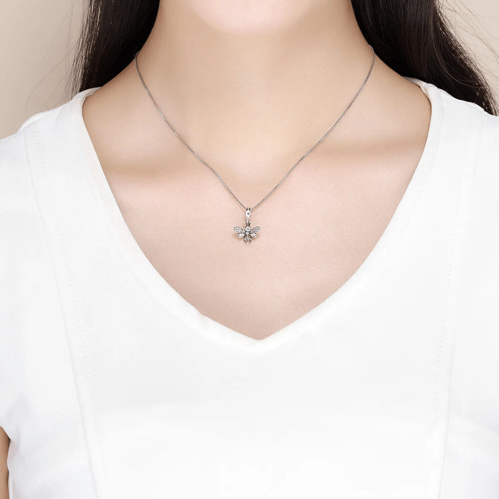 Sterling silver bee charm with crystal-paved wings and orange gemstone stripes 