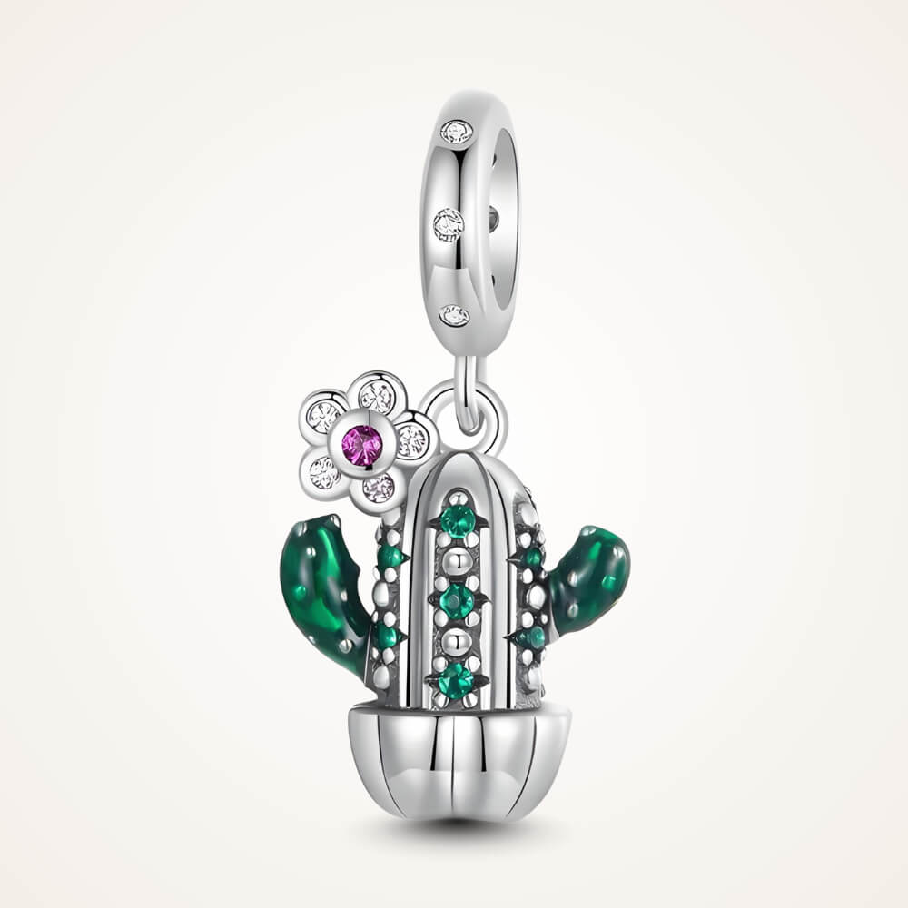 Sterling silver cactus charm with green enamel arms, green gemstones, and a small flower pendant with a pink crystal – ORÉYA.