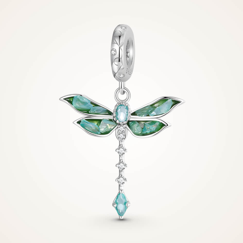 Sterling silver dragonfly charm with blue-green iridescent enamel wings, sparkling clear stones, and a teardrop blue crystal tail – ORÉYA