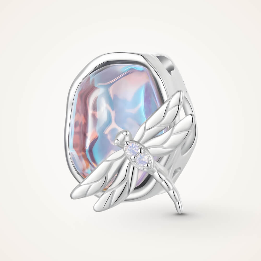 Sterling silver charm with an iridescent pastel glass stone and a silver dragonfly decorated with clear crystals – ORÉYA.