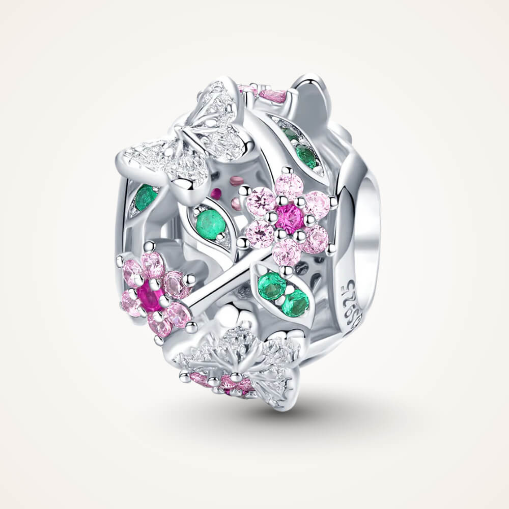 Sterling silver openwork charm with pink crystal flowers, green crystal leaves, and silver butterflies with clear stones – ORÉYA.