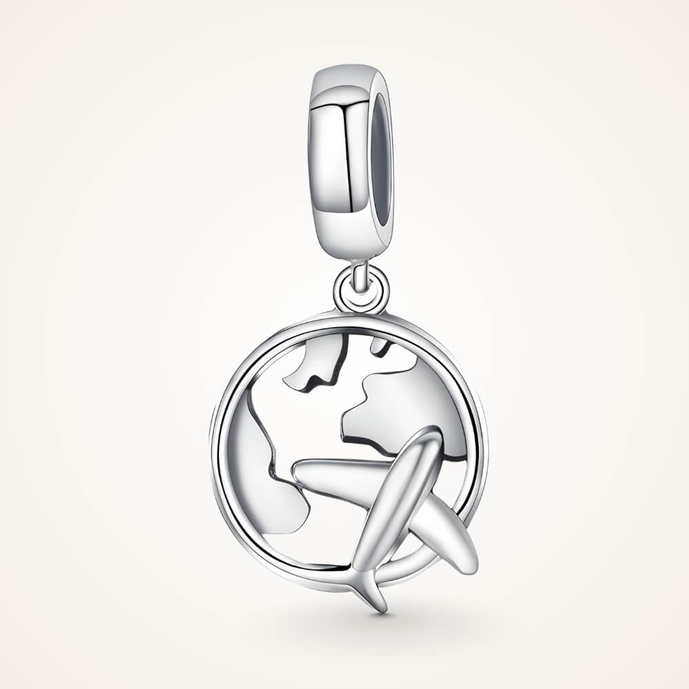 Sterling silver charm with a globe outline and a small airplane dangle in front – ORÉYA