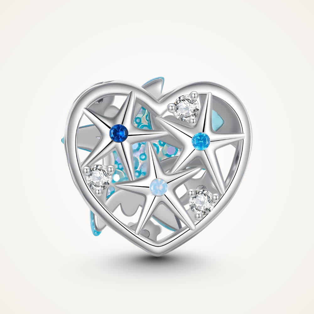 Sterling silver heart-shaped charm with a large blue crystal starfish, light-blue and clear stones, and an openwork background