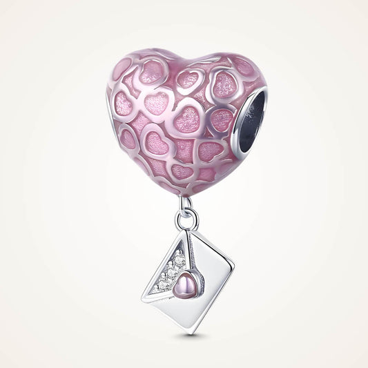 Sterling silver heart charm with pink enamel heart patterns and a dangling envelope accented with a small pink heart – ORÉYA