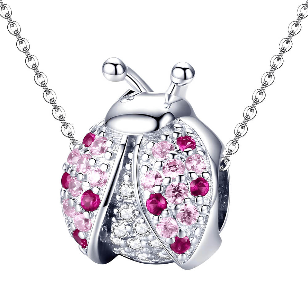 Sterling silver ladybug charm with pink and red crystals on the wings and clear stones on the body 