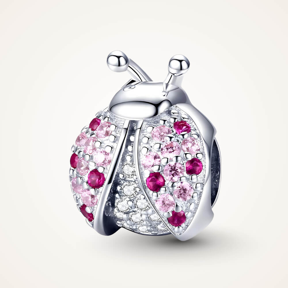 Sterling silver ladybug charm with pink and red crystals on the wings and clear stones on the body – ORÉYA.