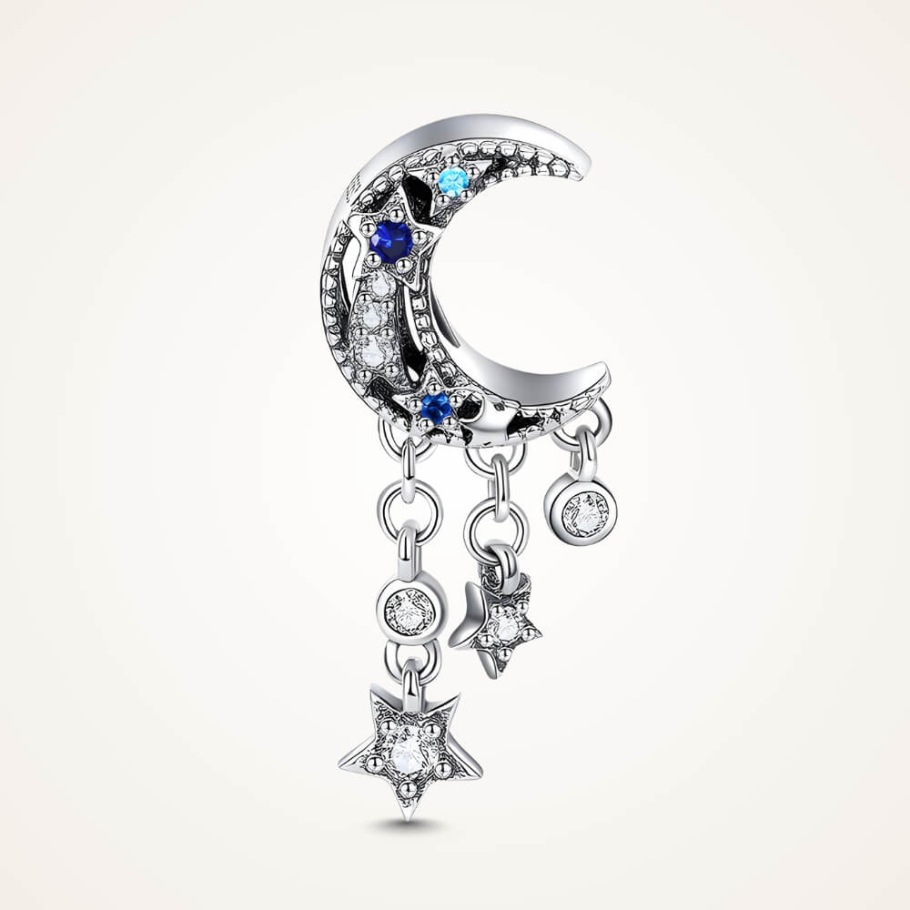 Sterling silver crescent moon charm with clear, dark blue, and light blue stones, featuring three dangling star and circle crystal accents – ORÉYA