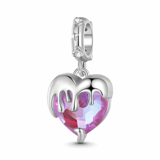 Sterling silver charm with a faceted pink heart crystal covered by a silver melting-drip design and a bail set with small clear stones – ORÉYA