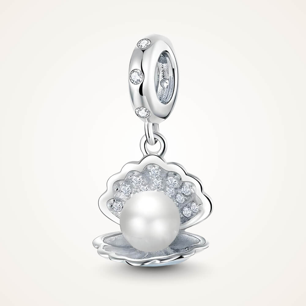 Sterling silver seashell charm with clear gemstones and a dangling white pearl bead - ORÉYA