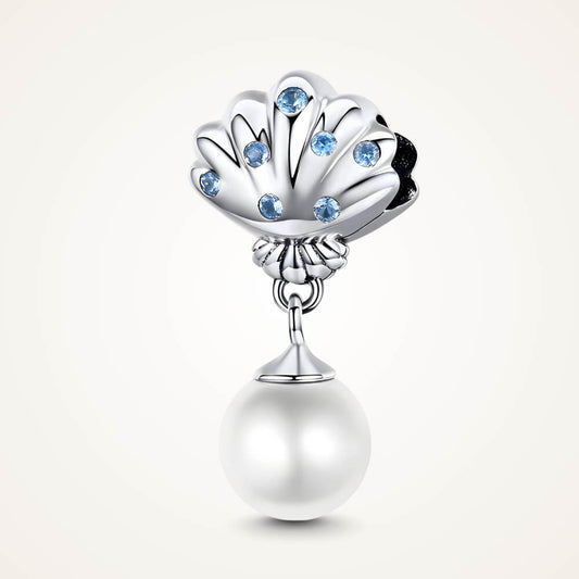 Sterling silver shell charm with blue gemstones and a dangling white pearl - ORÉYA