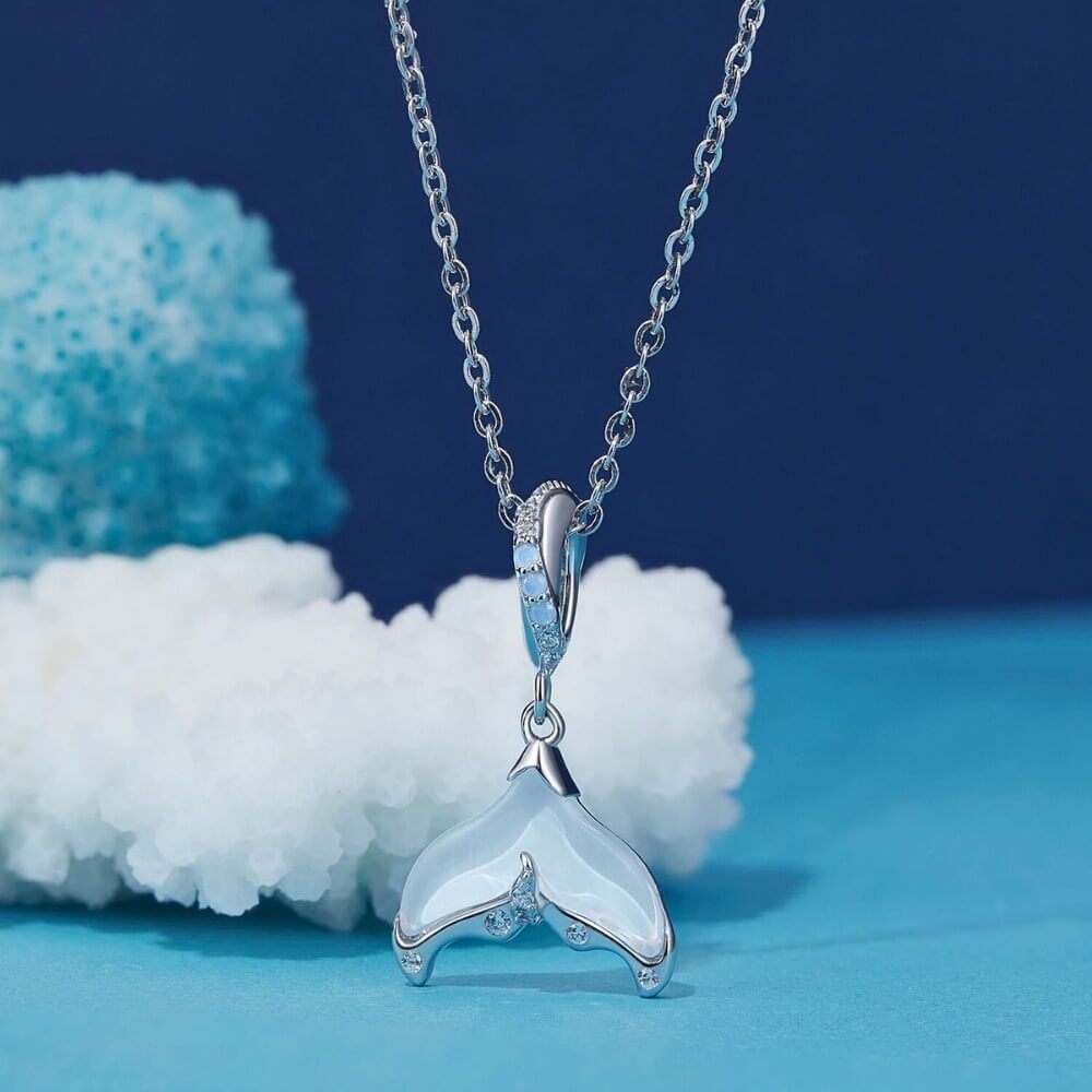 Sterling silver siren tail charm with iridescent enamel and crystals.