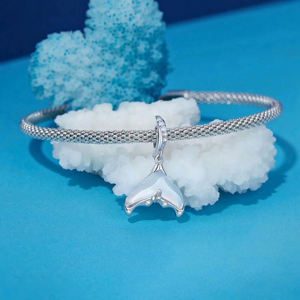 Sterling silver siren tail charm with iridescent enamel and crystals.