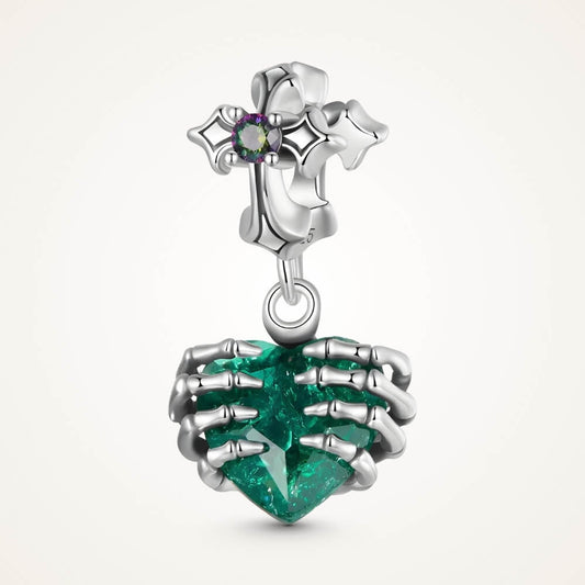 Sterling silver skeleton heart charm with emerald crystal and gothic details.