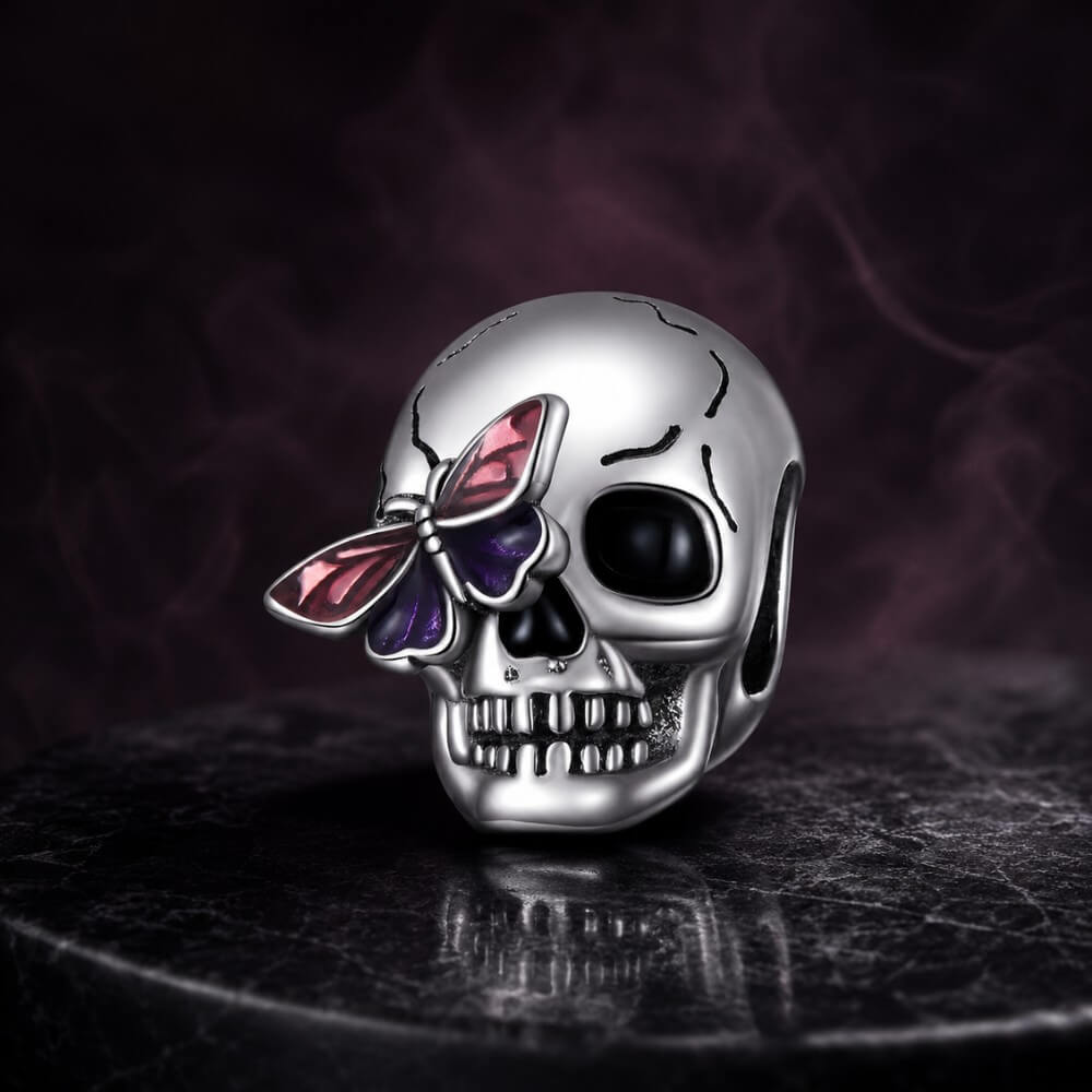 Sterling silver skull charm with purple butterfly and black enamel details.