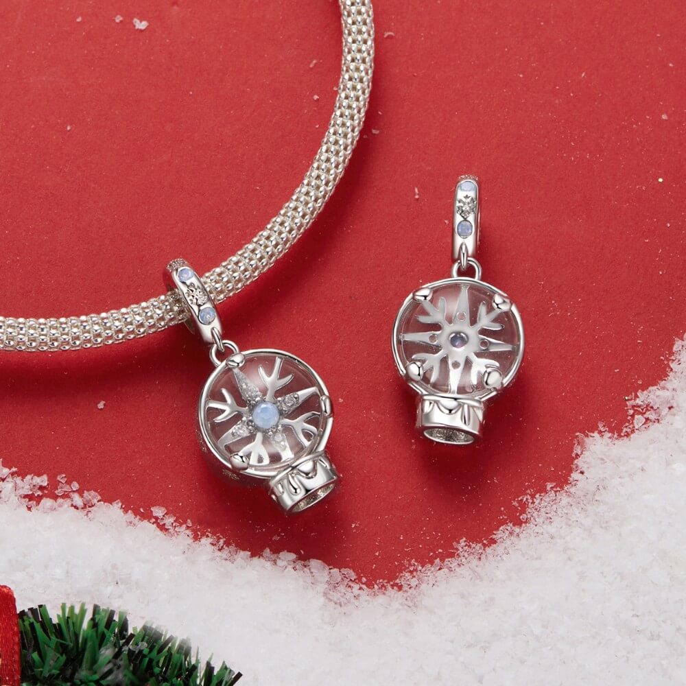 Sterling silver snow globe charm with snowflake and opal crystal.