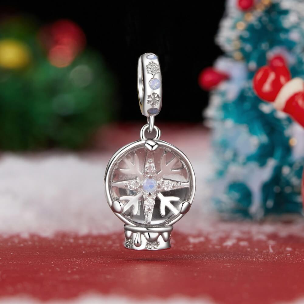 Sterling silver snow globe charm with snowflake and opal crystal.