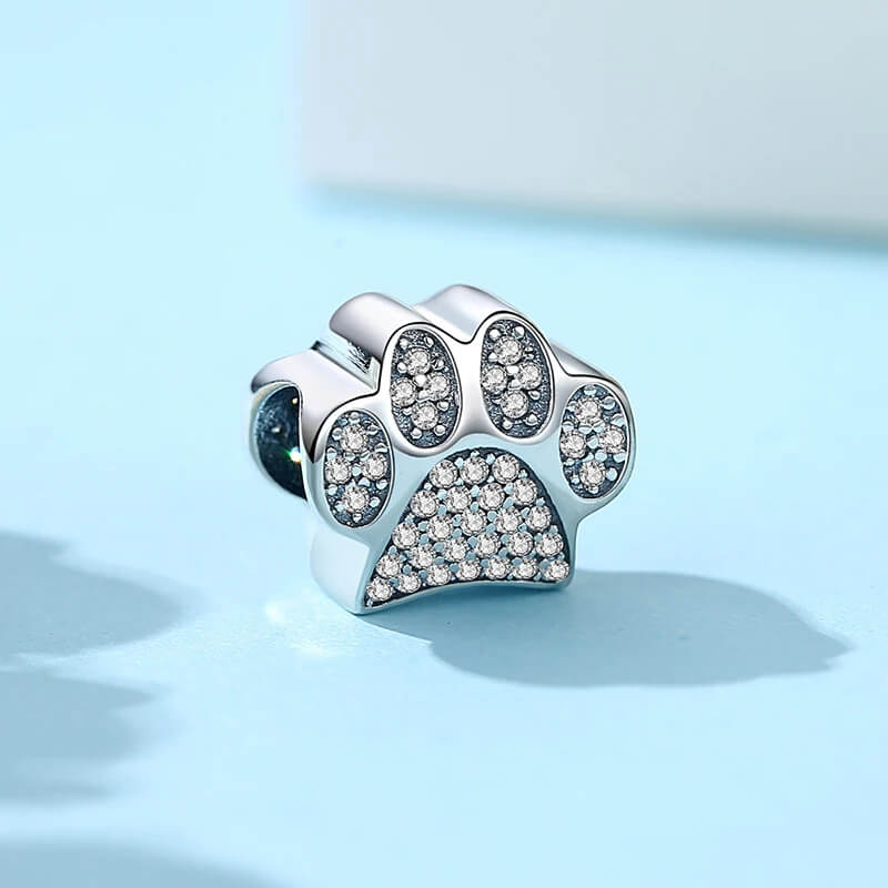 Sterling silver paw-print charm with sparkling clear zircon stones