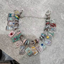 Sterling silver star tarot charm with blue crystal and mint enamel details.