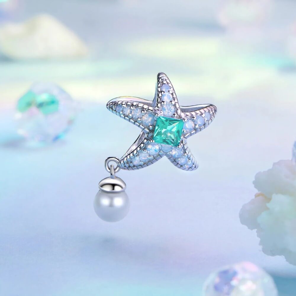 Sterling silver starfish charm with green crystal, opal stones, and pearl.