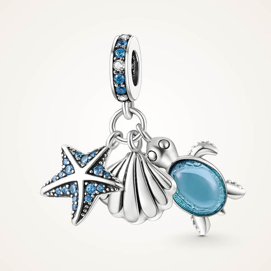 Sterling silver charm with starfish, shell, and blue glass turtle dangles on gemstone bail - ORÉYA