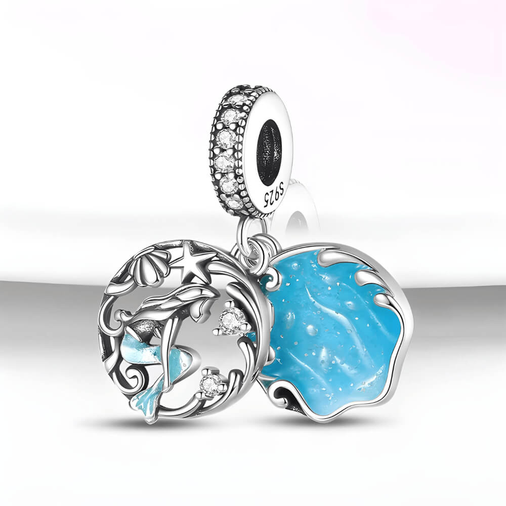 Sterling silver double dangle mermaid charm with blue enamel wave disc and gemstones.