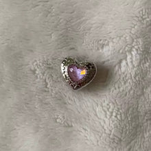 Sterling silver swan heart charm with pink crystal and pavé border.