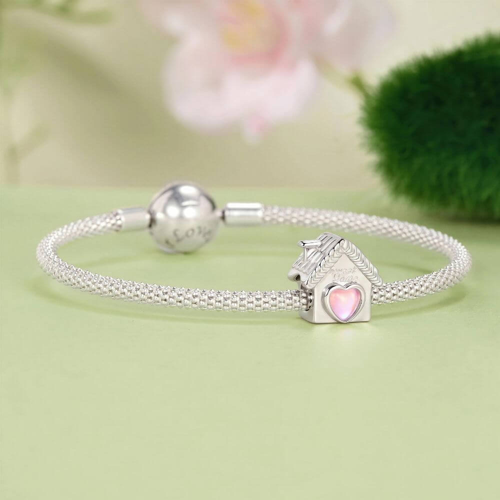 Sterling silver house charm with pink heart window, Sweet Home engraving, and detailed roof accents.