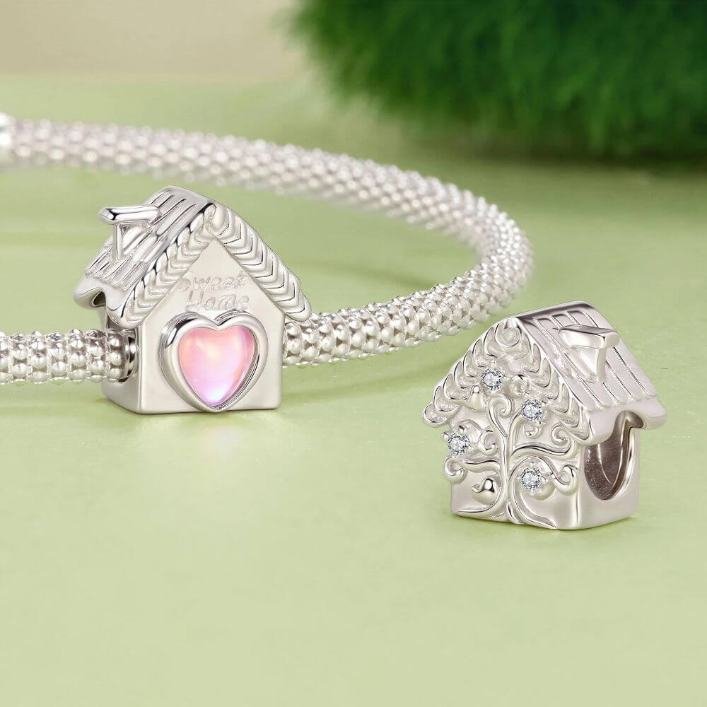 Sterling silver house charm with pink heart window, Sweet Home engraving, and detailed roof accents.