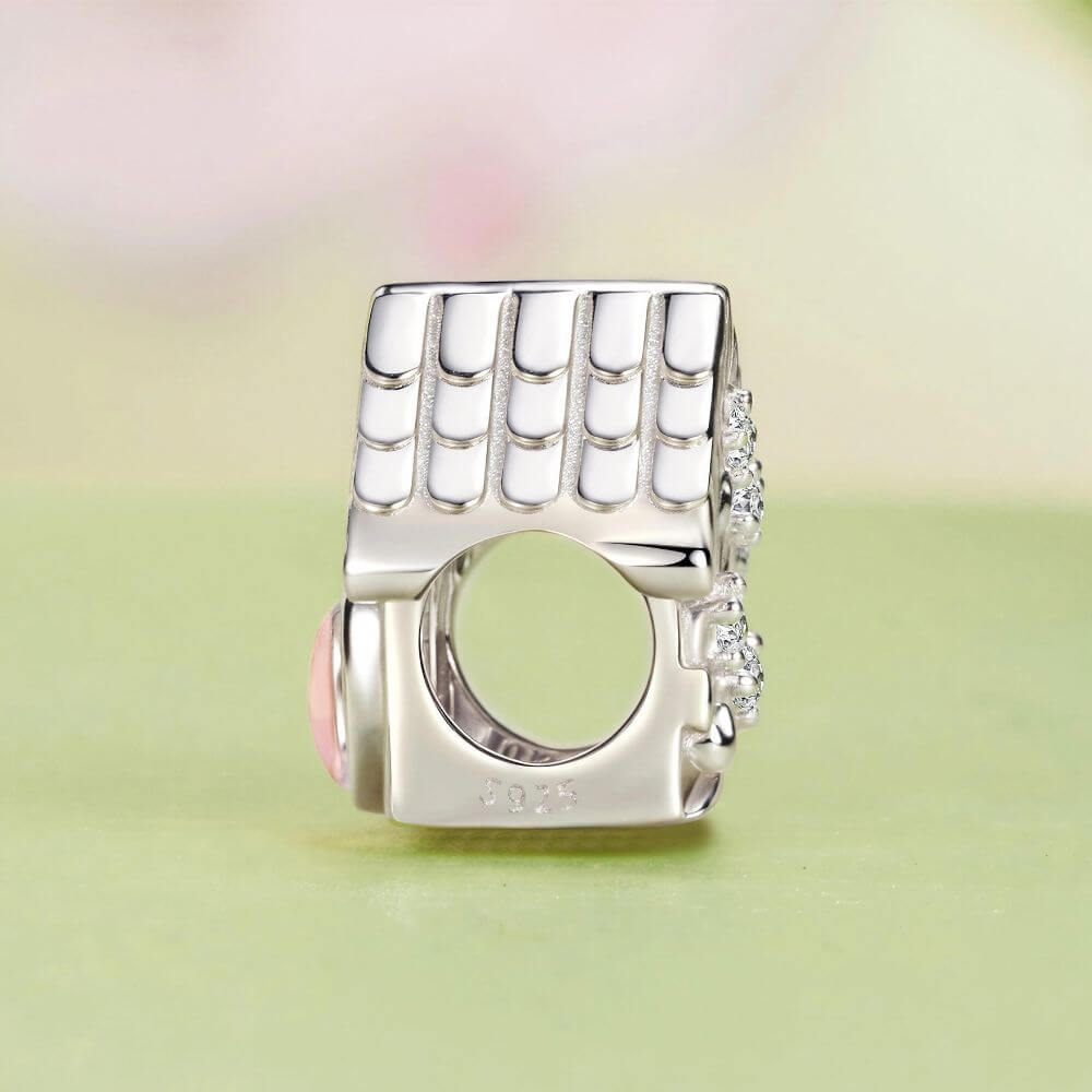 Sterling silver house charm with pink heart window, Sweet Home engraving, and detailed roof accents.