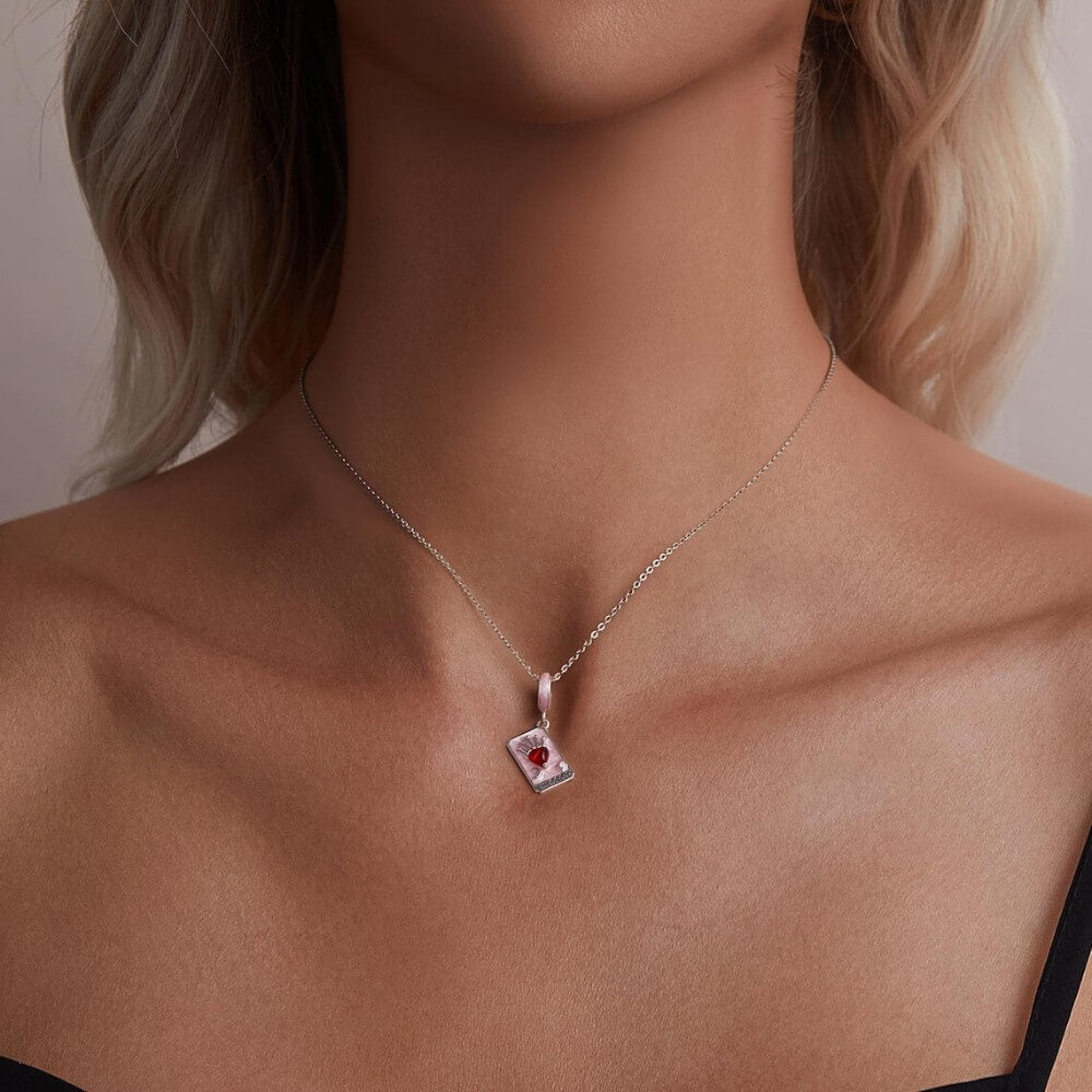 Sterling silver tarot card charm with red heart and crown.