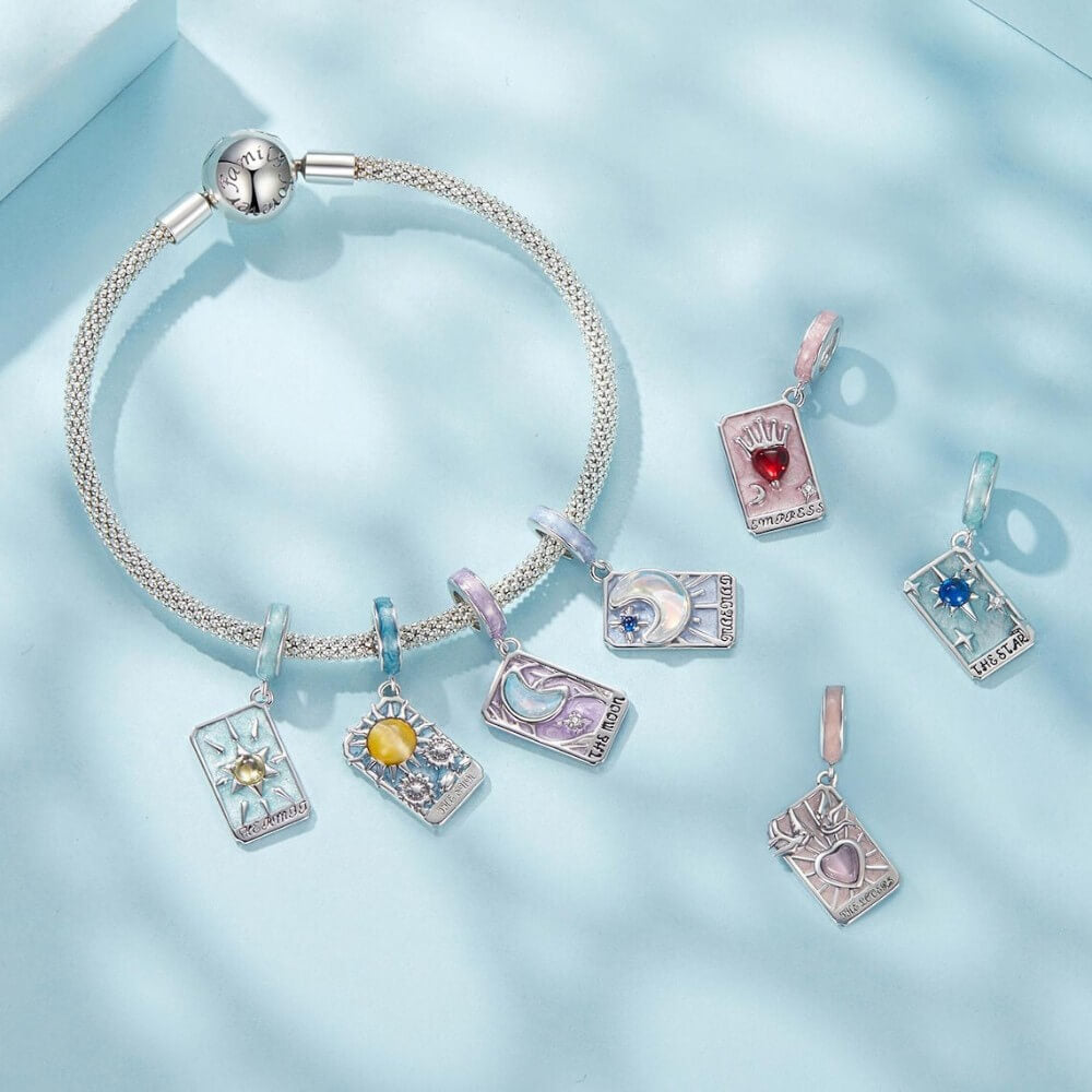 Sterling silver tarot card charm with red heart and crown.