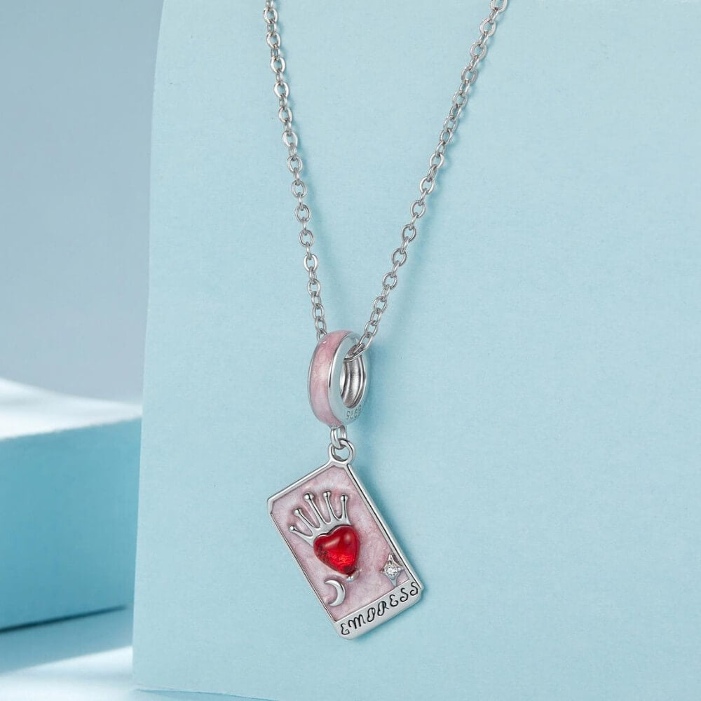 Sterling silver tarot card charm with red heart and crown.