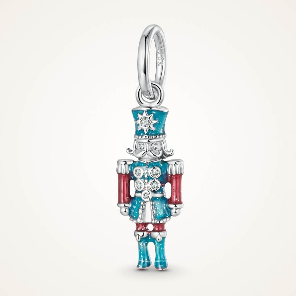 Sterling silver nutcracker charm with teal and red enamel and clear gemstones - ORÉYA