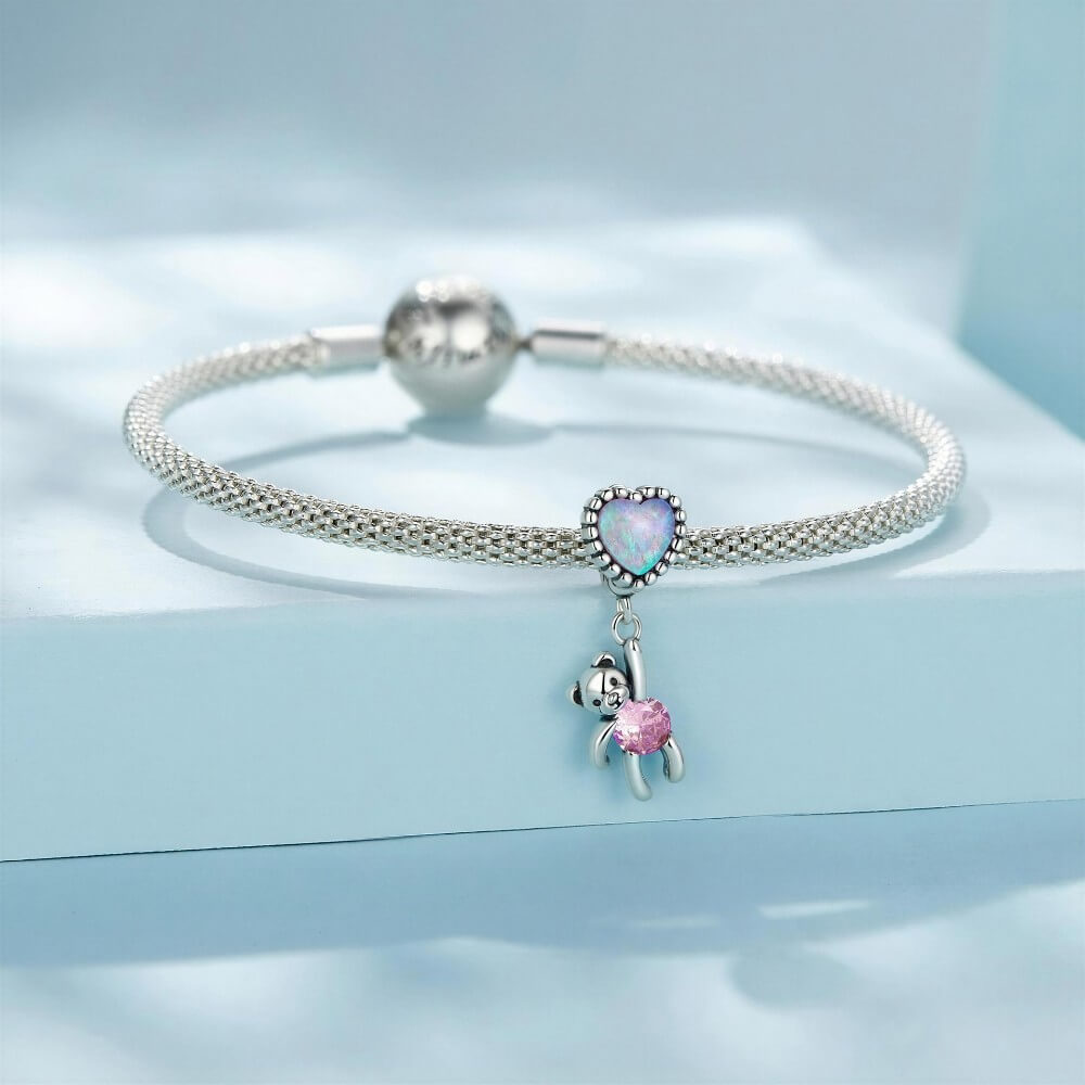 Sterling silver teddy bear charm with opal heart balloon and pink crystal.